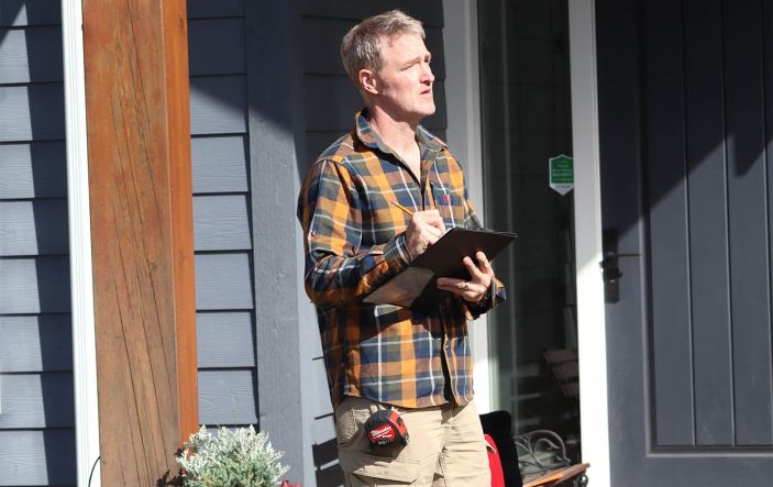 Rick writing down notes for home Energy View