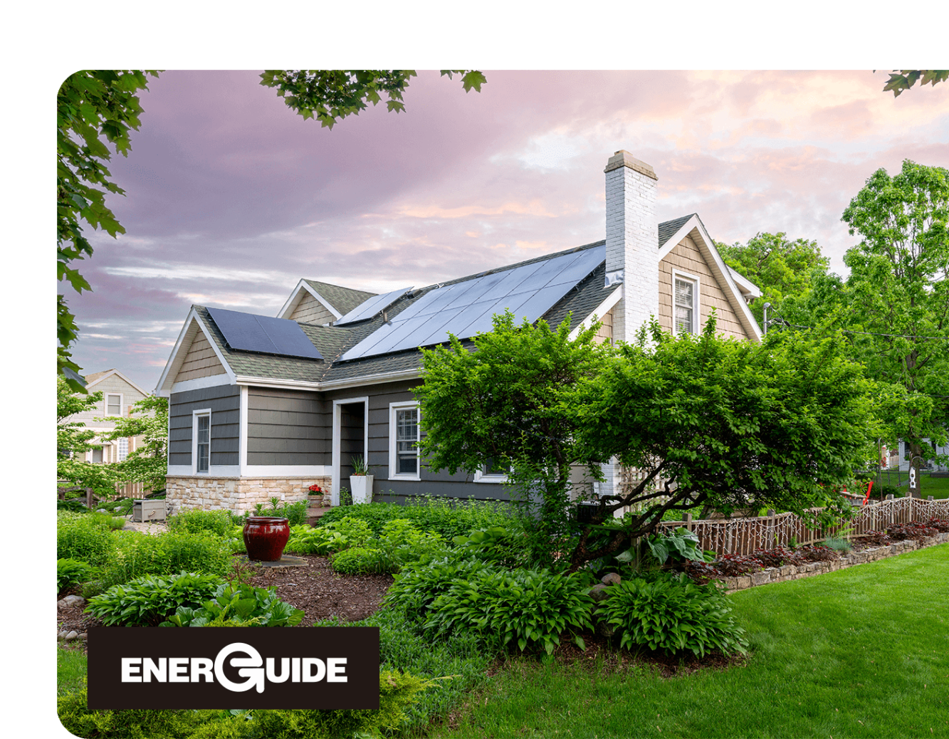 Energuide Assessments Hero image energy efficient home with solar panels and garden in the front