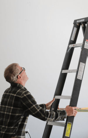 Rick Martin standing on ladder Energy View