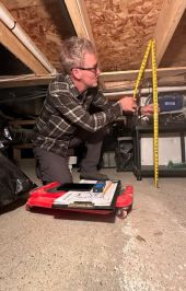 Rick Martin measuring inside home Energy View