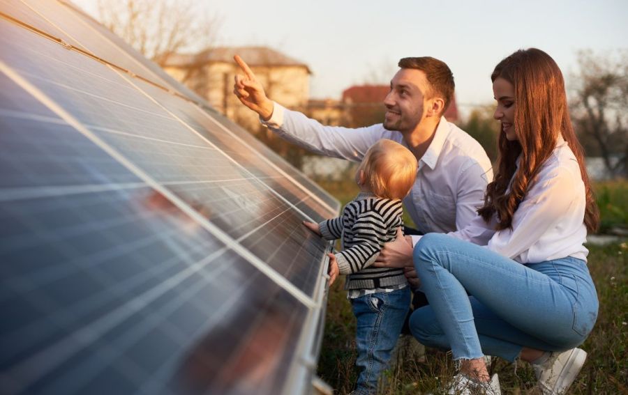 Family looking at solar panels of home Energy View